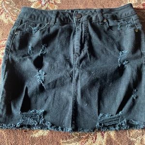 Distressed black denim skirt